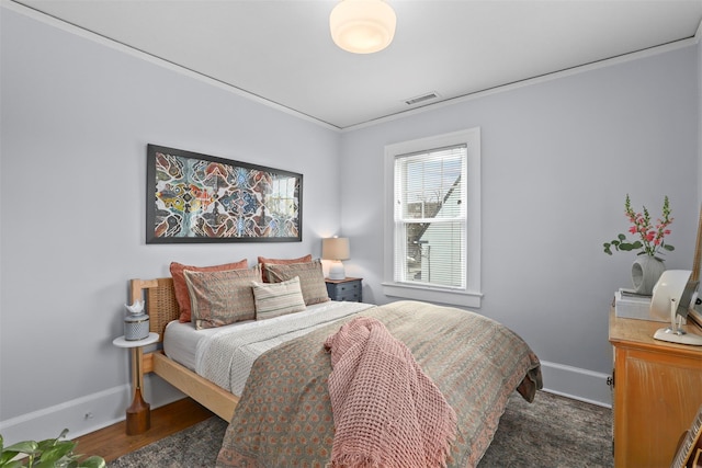 bedroom with dark hardwood / wood-style floors