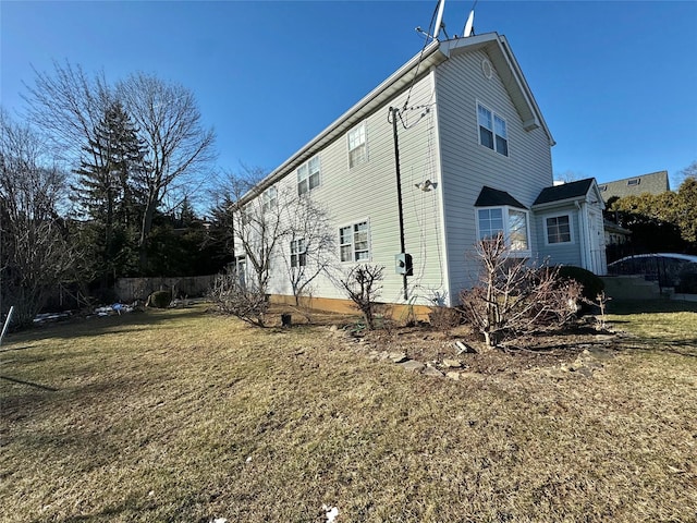 view of home's exterior featuring a lawn