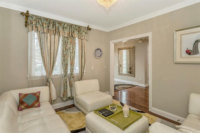 living room featuring crown molding and hardwood / wood-style floors