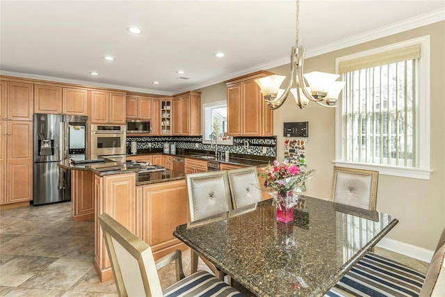 kitchen featuring decorative light fixtures, stainless steel appliances, a kitchen island, brown cabinetry, and glass insert cabinets