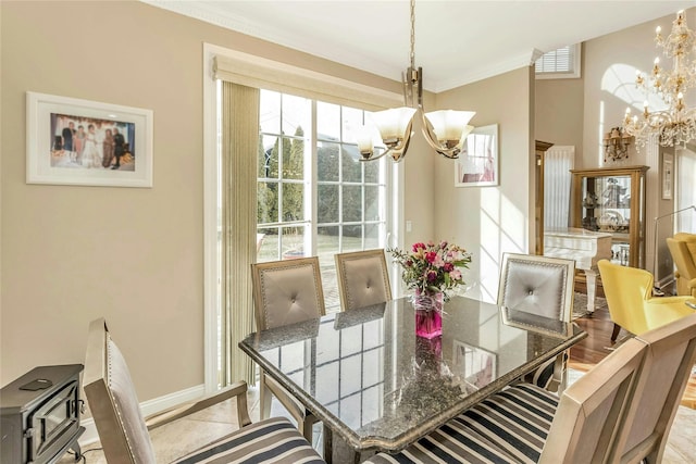 dining room featuring crown molding and an inviting chandelier