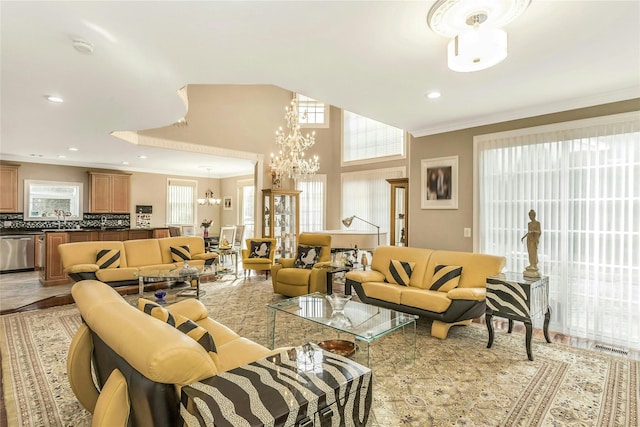 living area featuring ornamental molding, recessed lighting, visible vents, and an inviting chandelier