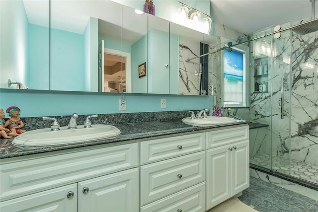 bathroom featuring vanity and a shower with shower door