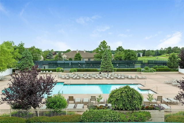 view of swimming pool with a patio