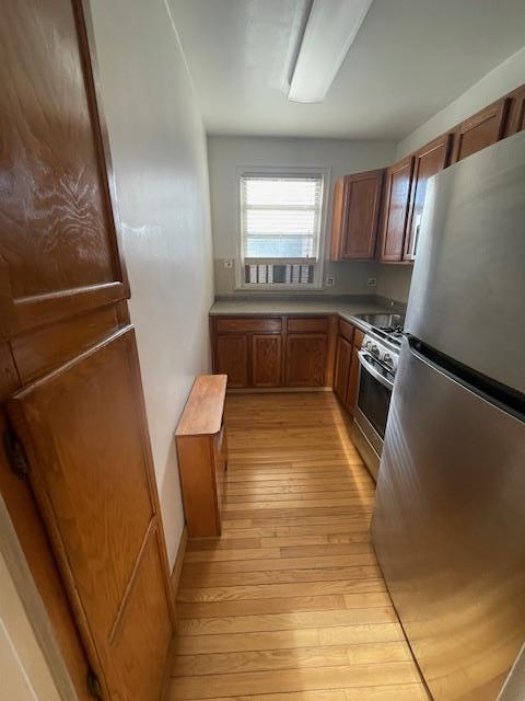 kitchen featuring stainless steel appliances and light wood-type flooring