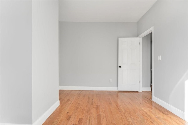 empty room with light hardwood / wood-style floors