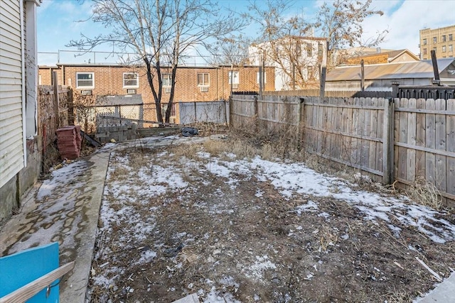 view of yard covered in snow