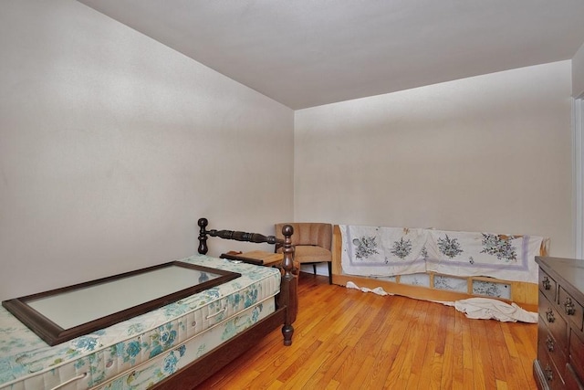 bedroom with light wood-type flooring