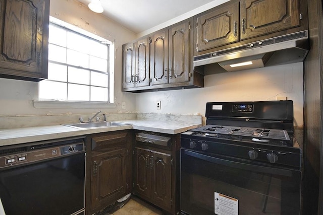 kitchen featuring sink, dark brown cabinets, and black appliances