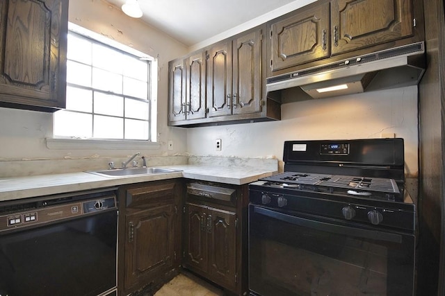 kitchen featuring dark brown cabinets, sink, and black appliances