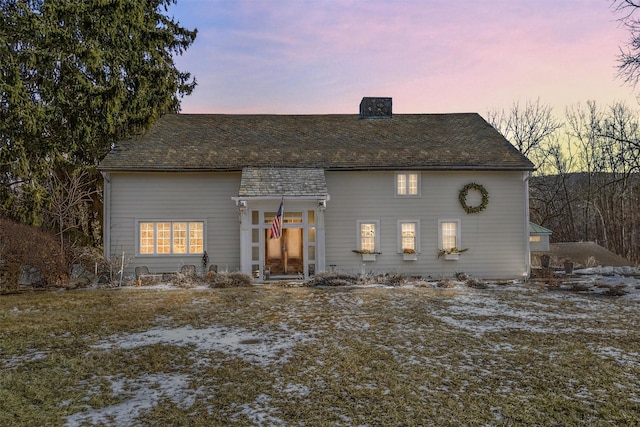 view of front of house with a chimney