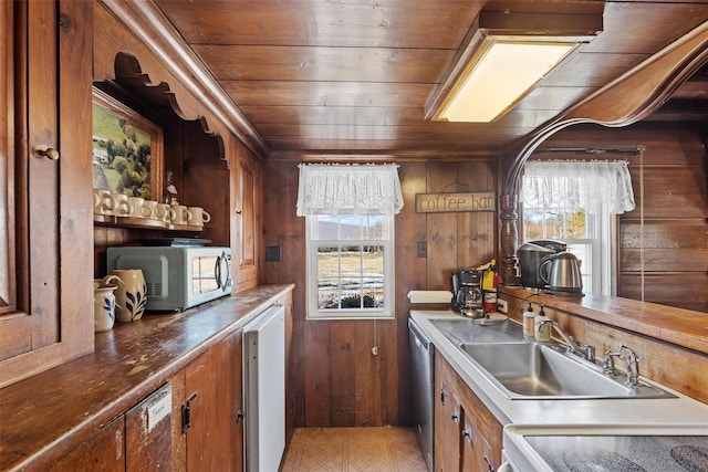 kitchen with wooden ceiling, white microwave, plenty of natural light, and dishwasher