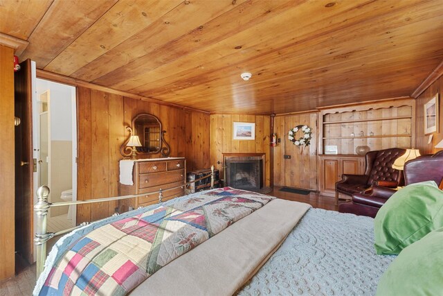 100 Pleasant Hill Rd, New Windsor, NY 12553 - bedroom with wooden ceiling, hardwood / wood-style floors, wooden walls, and a fireplace