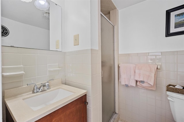 100 Pleasant Hill Rd, New Windsor, NY 12553 - bathroom featuring tile walls, a shower stall, vanity, and toilet