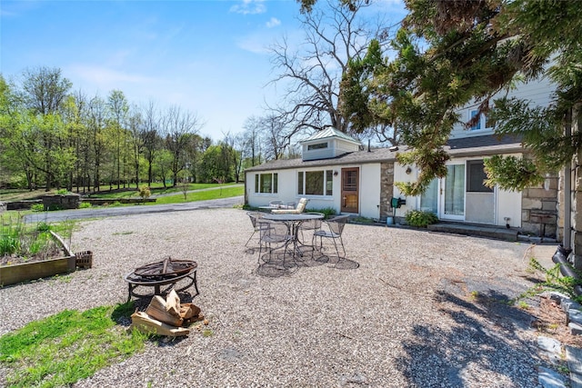 100 Pleasant Hill Rd, New Windsor, NY 12553 - back of property featuring a fire pit, a patio, and stone siding