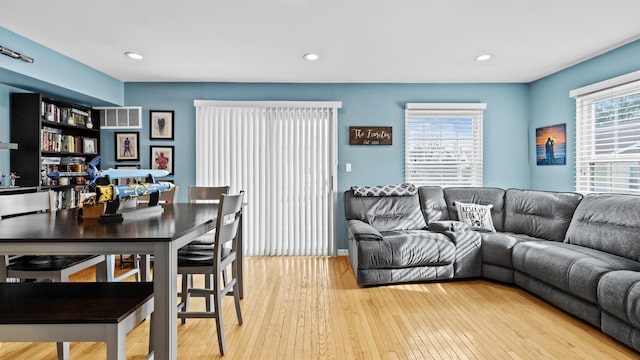 living room with light hardwood / wood-style flooring