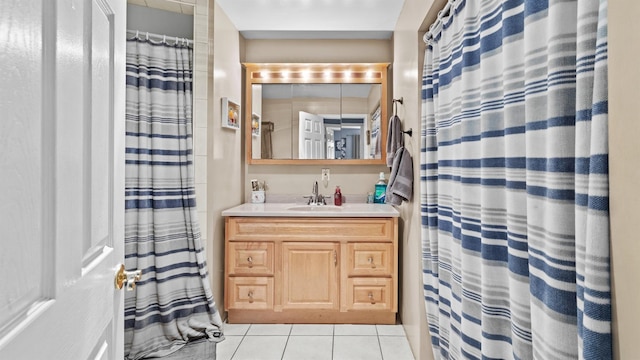 bathroom featuring tile patterned flooring and vanity