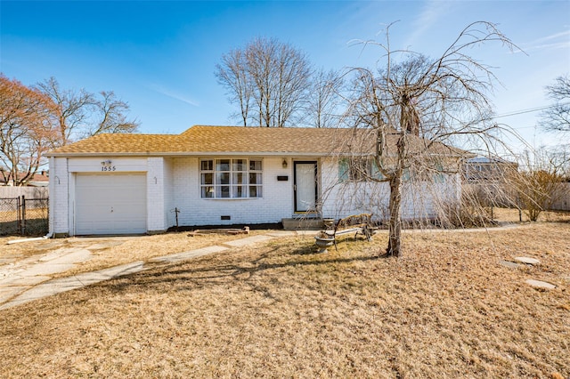 single story home featuring a garage and a front yard