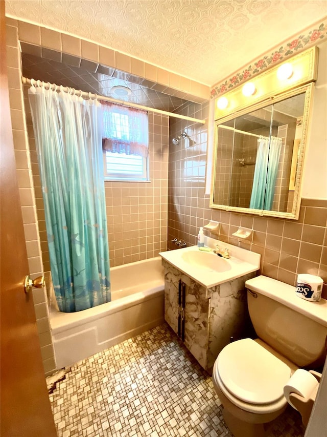 bathroom with toilet, tasteful backsplash, a textured ceiling, tile walls, and shower / bath combo