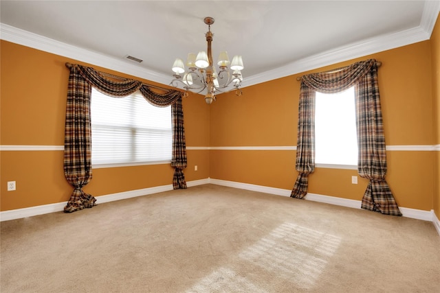 unfurnished room featuring ornamental molding, a chandelier, and carpet