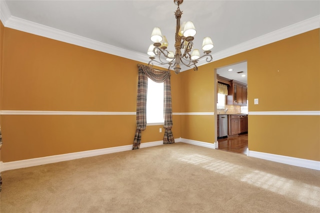 unfurnished room featuring ornamental molding, a chandelier, and carpet