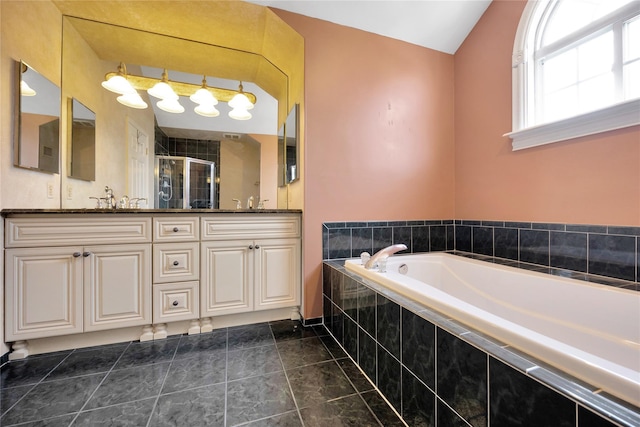 bathroom with vanity, tile patterned flooring, and shower with separate bathtub