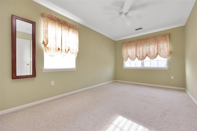 carpeted empty room featuring ceiling fan and ornamental molding