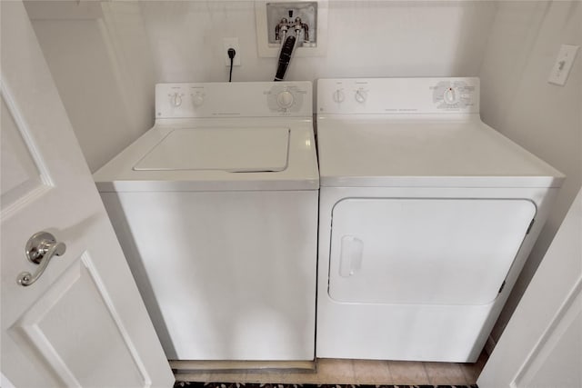 laundry room featuring washing machine and clothes dryer