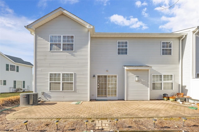 back of house featuring central AC and a patio area