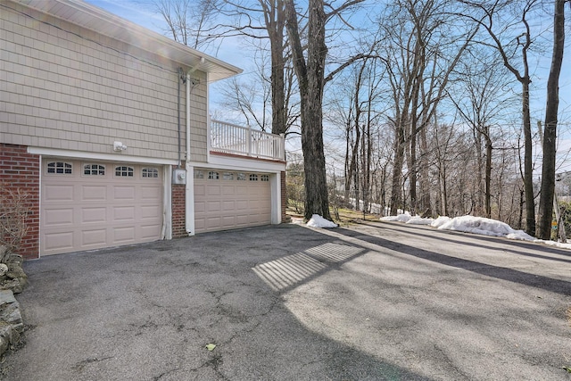 garage featuring aphalt driveway