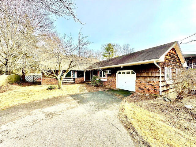 single story home featuring a garage