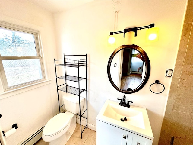 bathroom with vanity, toilet, wood-type flooring, and a baseboard heating unit