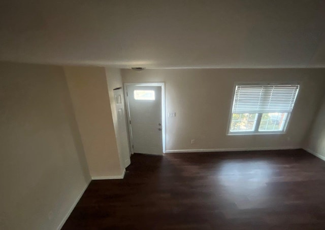 entryway with dark wood-type flooring