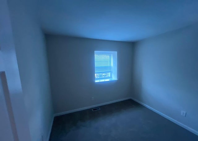 spare room featuring carpet flooring