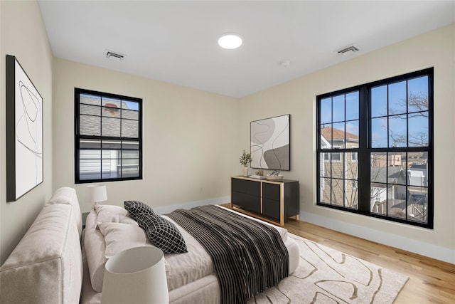 bedroom with light hardwood / wood-style floors