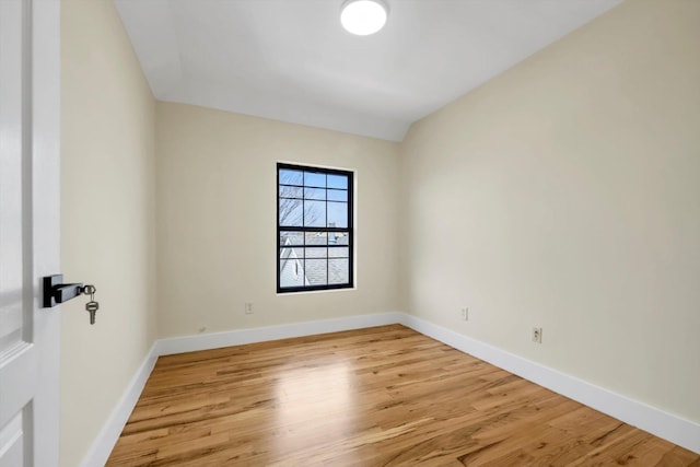 unfurnished room with light wood-type flooring