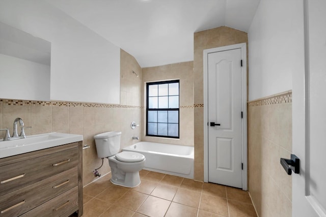 bathroom featuring toilet, tile patterned flooring, tile walls, and a bath