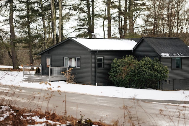 view of front of property with a wooden deck