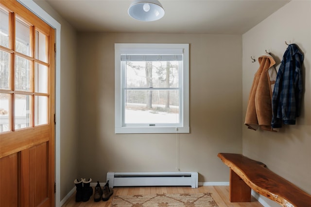 mudroom with light wood-type flooring and baseboard heating