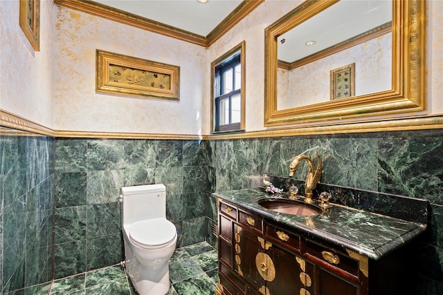 bathroom featuring ornamental molding, toilet, and vanity