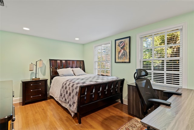 bedroom with light hardwood / wood-style floors