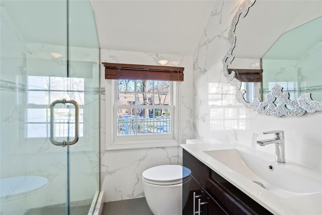 bathroom with lofted ceiling, tile walls, vanity, a shower with shower door, and toilet