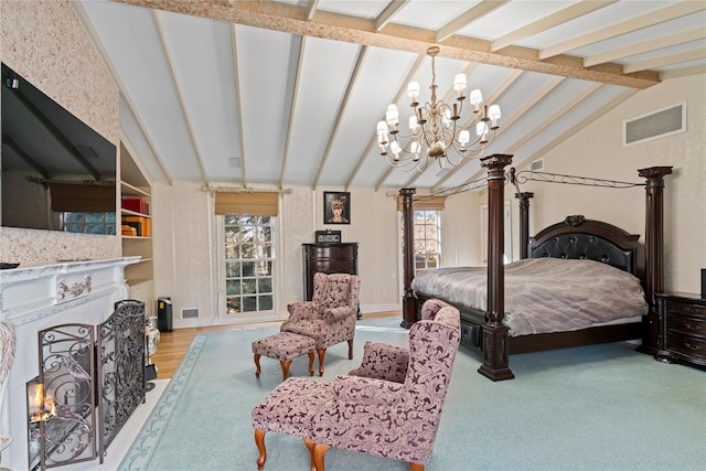 bedroom with multiple windows, lofted ceiling with beams, and a chandelier