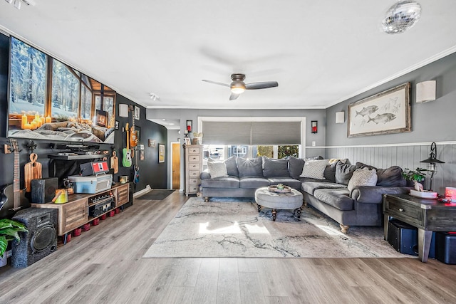 living room with hardwood / wood-style floors and ornamental molding