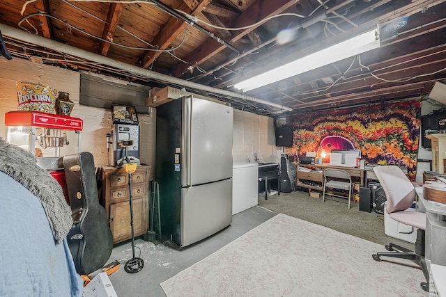 basement featuring refrigerator, stainless steel fridge, and electric panel