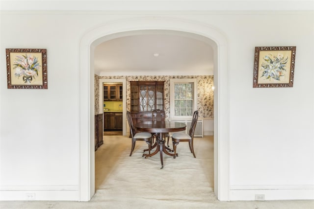 interior space featuring crown molding and carpet flooring