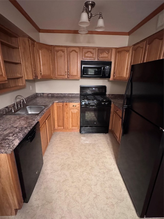 kitchen featuring sink, ornamental molding, and black appliances