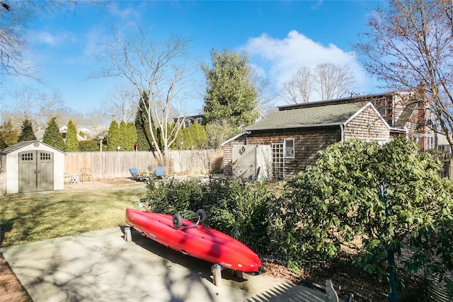 view of yard with a patio and a shed