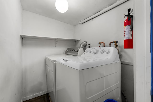 laundry room with washing machine and clothes dryer