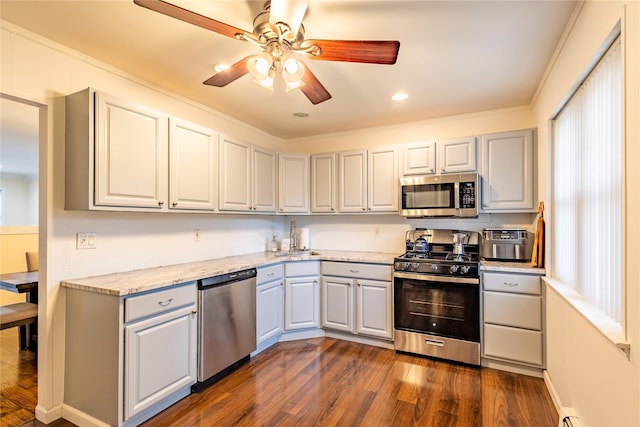 kitchen with stainless steel appliances, dark hardwood / wood-style flooring, and gray cabinets